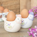 Sett med 2 blomstrete høne eggeglass